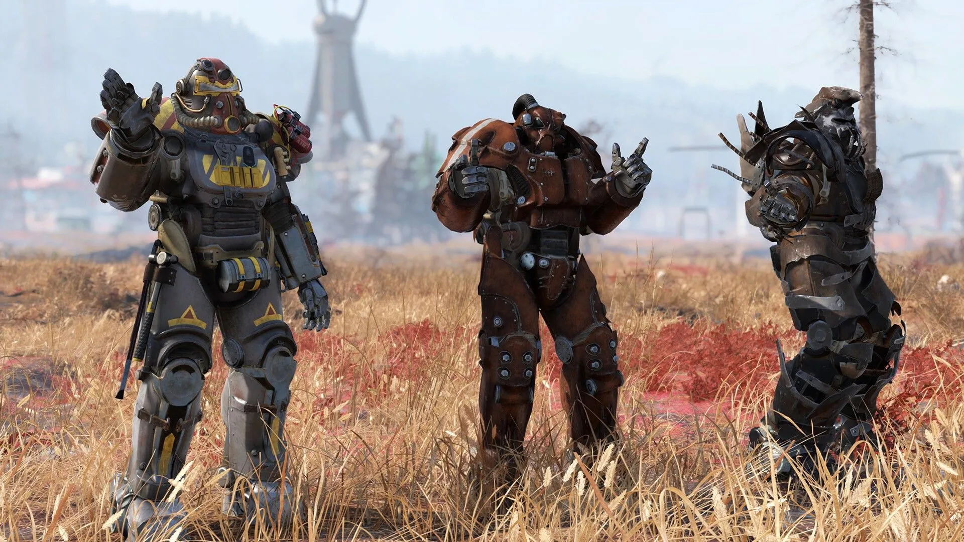 Ba người chơi trong trang bị giáp lực (Power Armor) đầy đủ tại thế giới hậu tận thế của Fallout 76.