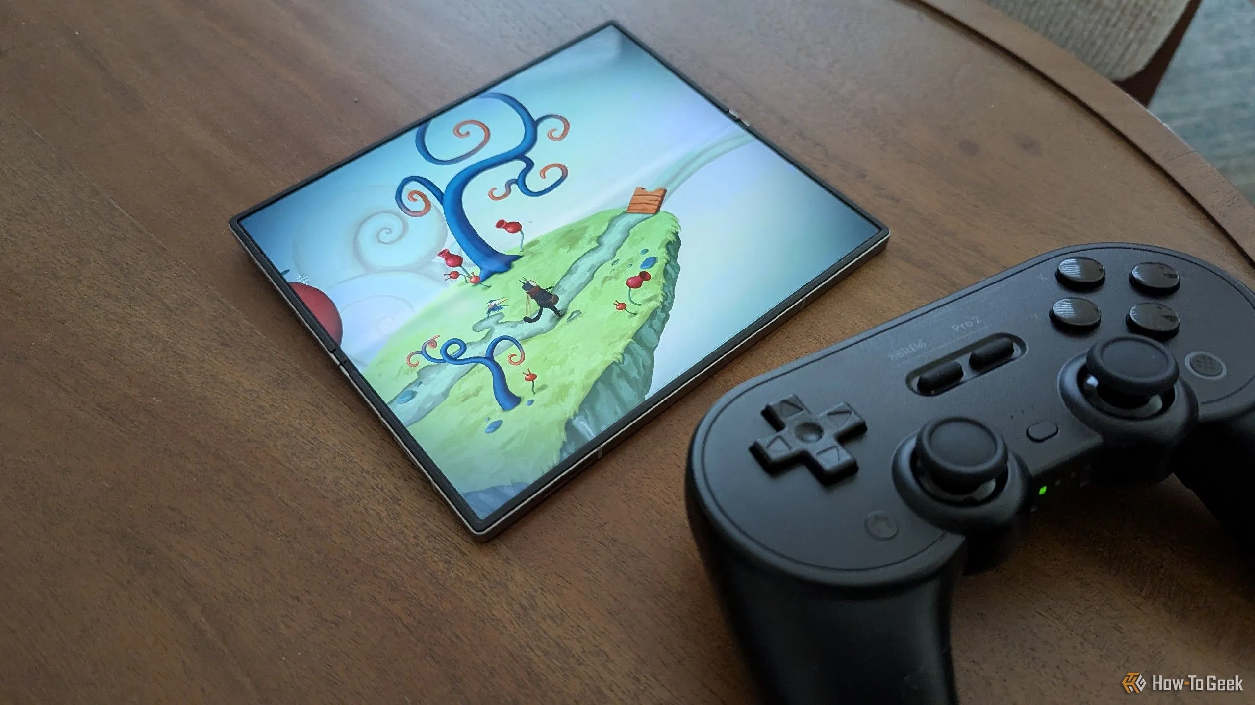 Game Figment hiển thị trên Samsung Galaxy Z Fold 6 cùng tay cầm 8BitDo Pro 2
