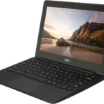 Laptop Dell Chromebook 11 màu đen với màn hình mở, đặt trên bàn làm việc.