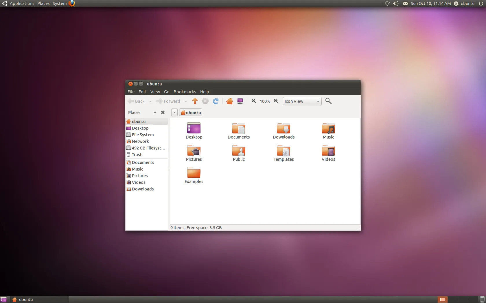 Màn hình desktop Ubuntu 10.10 Maverick Meerkat với tông màu tối và cách bố trí giao diện mới lạ.