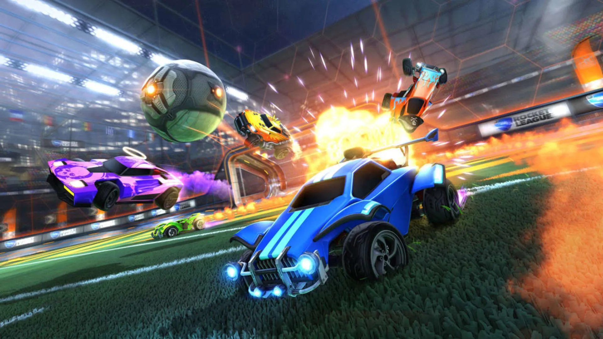 Một pha hành động hỗn loạn với xe ô tô và quả bóng bay lên không trung trong game Rocket League, thể hiện lối chơi độc đáo &quot;bóng đá xe hơi&quot;.