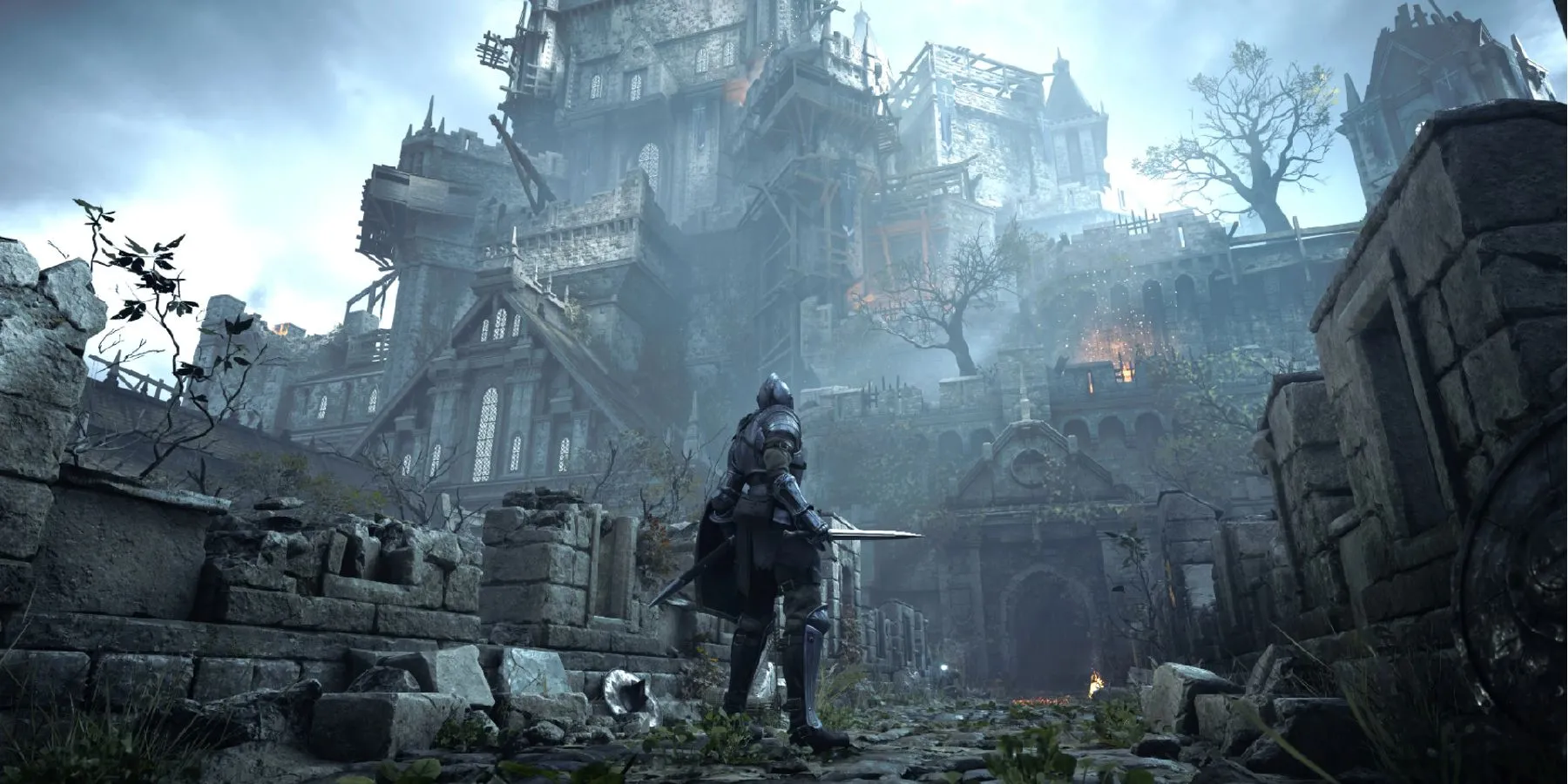 Thế giới Boletaria trong Demon's Souls Remastered (2020) trên PlayStation 5, minh họa sự nâng cấp đồ họa ấn tượng nhưng vẫn giữ nguyên mã nguồn gốc.
